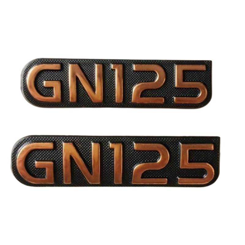 Par de Emblema da Tampa Lateral GN125 Original - Suzuki - Parafuso